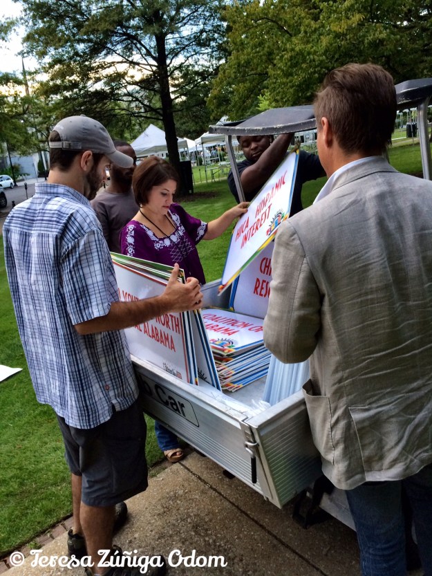 Our event planner, Denise Koch, works on getting the signage up in Linn Park.