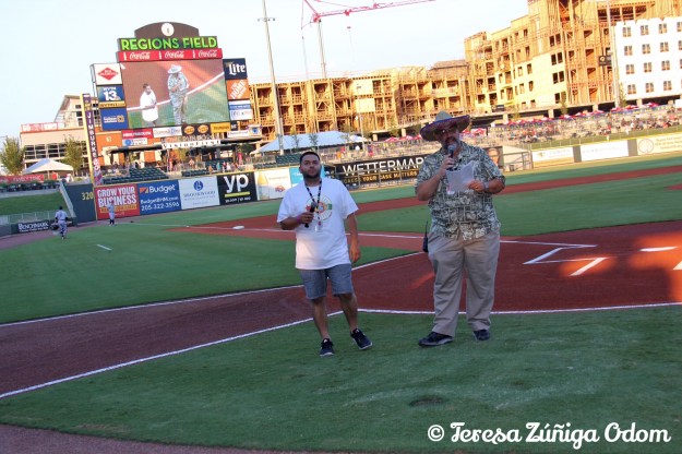 Fiesta board member, Orlando Rosa helps Don Leo of The Barons open up the game festivities in Spanish!