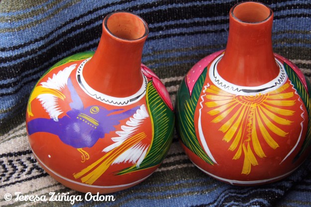 Jarrito jars at the Mexico booth.  This is the type of clay jar that Maria and Luis gave to me at Fiesta.  So beautiful!!!