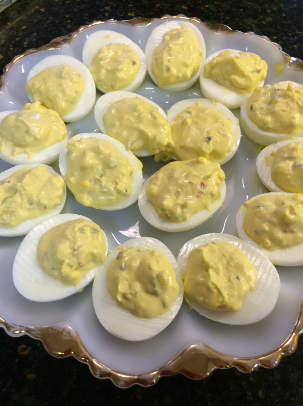 Deviled eggs...a little mayo, mustard and sweet pickle relish. Delish!