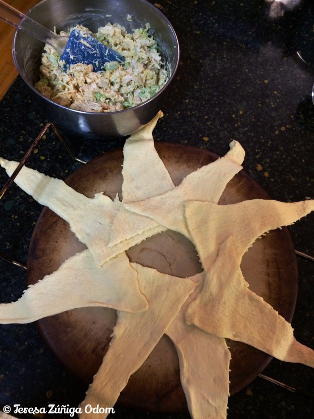 Crescent rolls are arranged in a star design with the large end in the center.  It never looks as perfect as it does in the pictures...