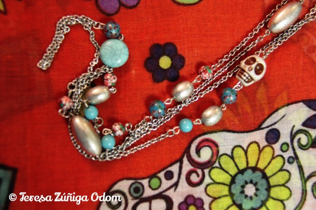 Long sugar skull necklace with cloisonné beads, and silver beads.