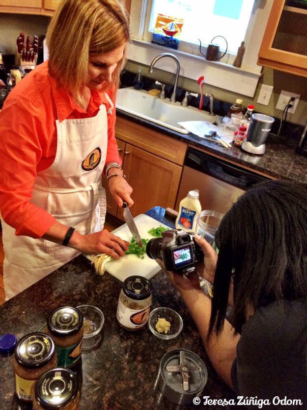 Lori works on the slaw ingredients while Jessica Chriesman does some filming.