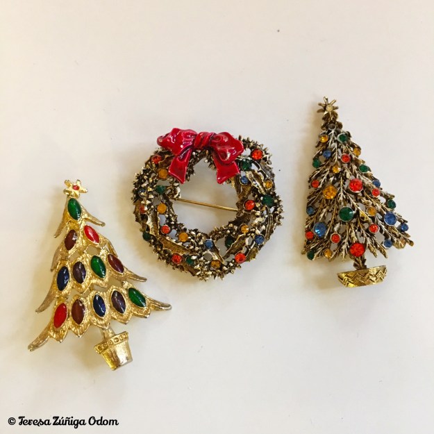 The wreath and tree on the right are ART(c) marked and considered very collectible Christmas pieces! I love the colors on the tree to the left - no markings on this pin but very art deco looking.