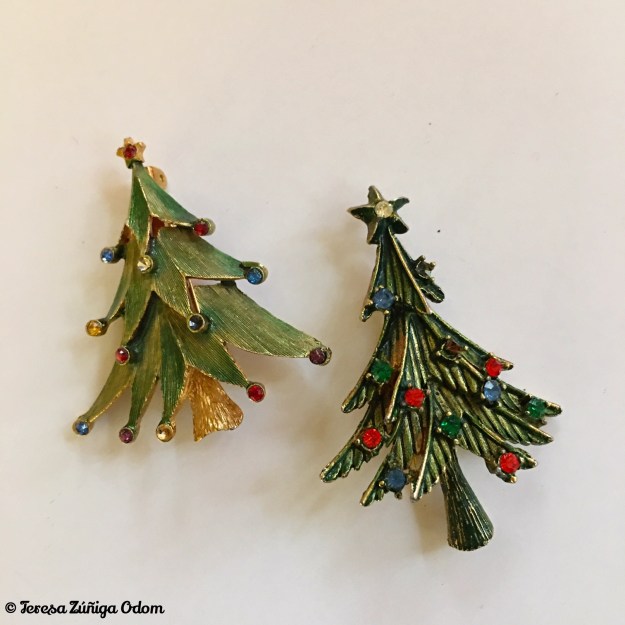 The tree pin on the left is a JJ(c) Jonette Jewelry Company piece. The tree on the right has no markings.